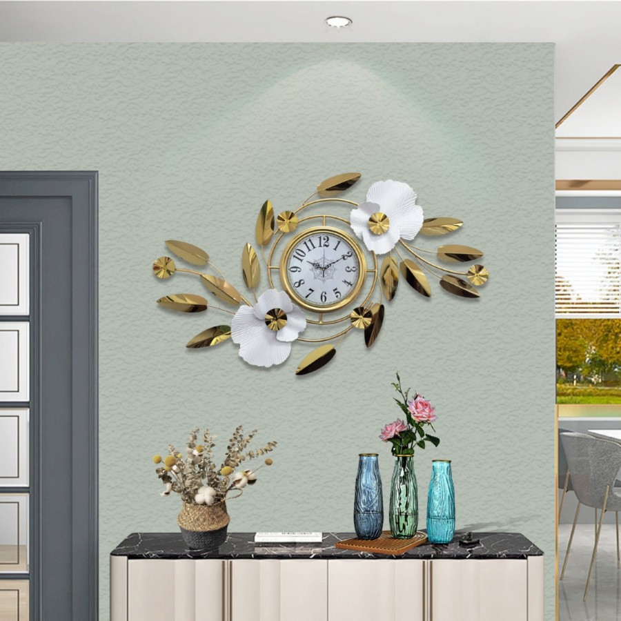 Metal wall clock with gold floral decoration