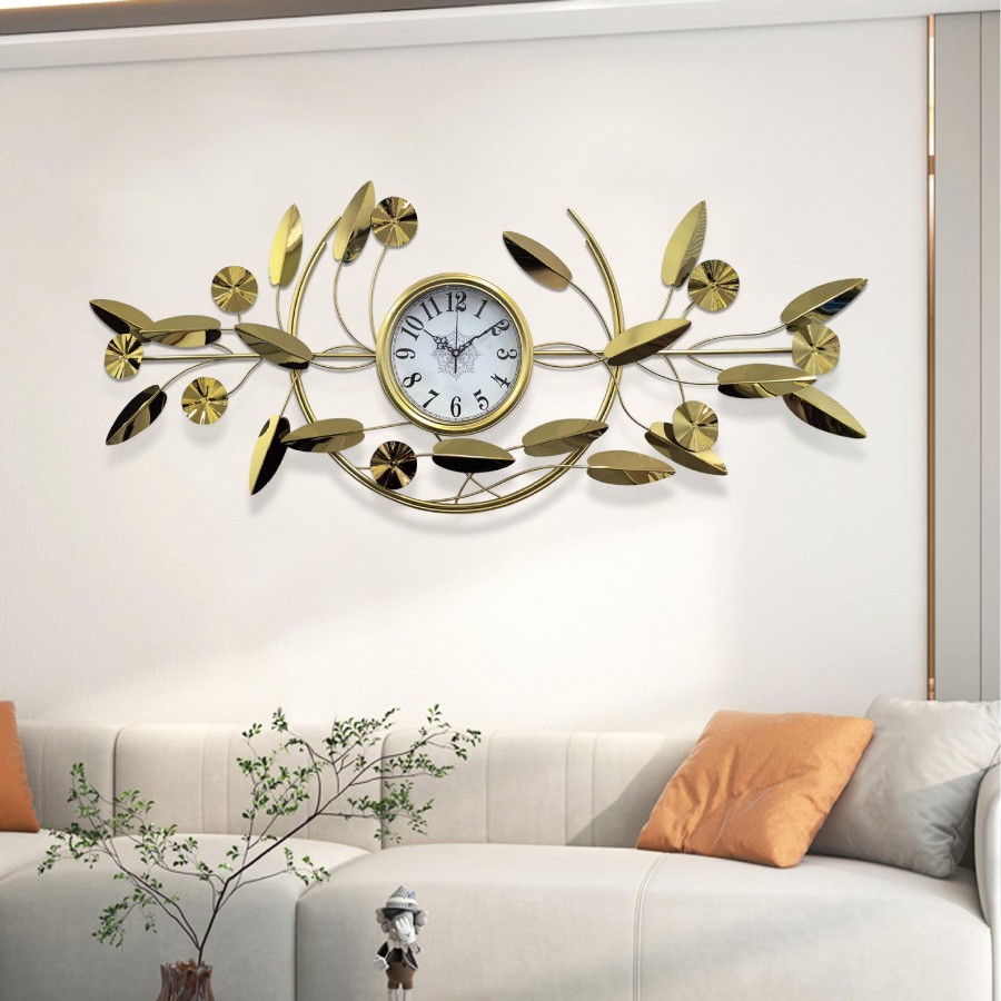 Golden floral wall clock with leaf decoration